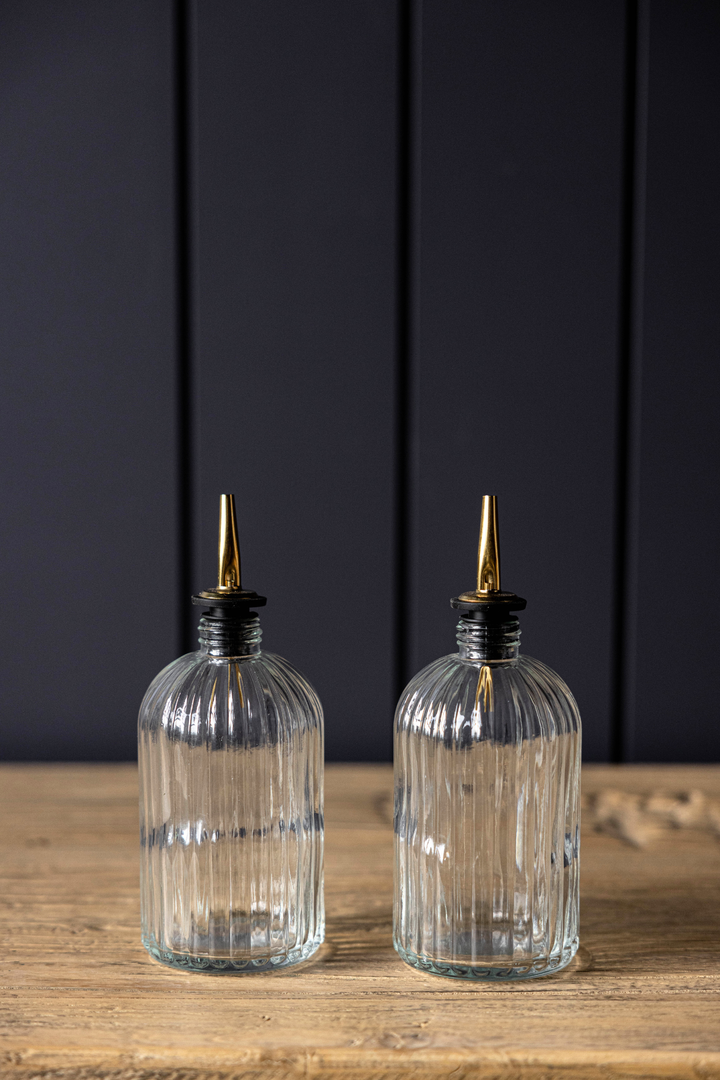 clear glass olive oil bottles with gold spout