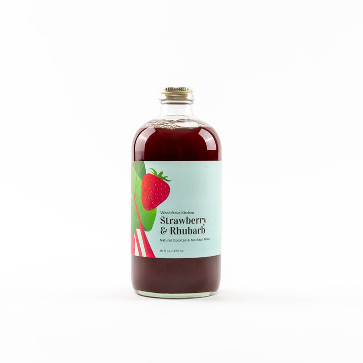 Bottle of strawberry rhubarb syrup on a white background