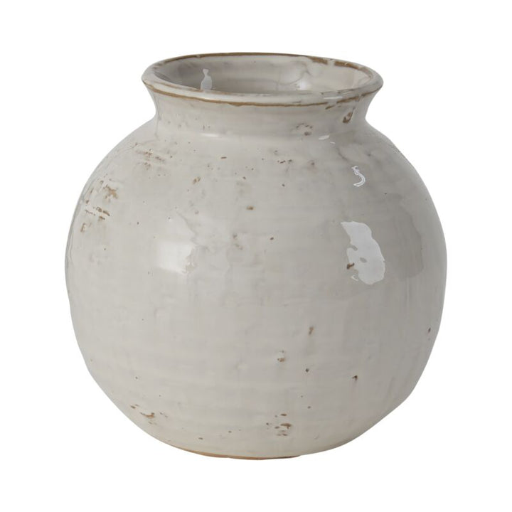 White ceramic vase with a textured surface on a white background