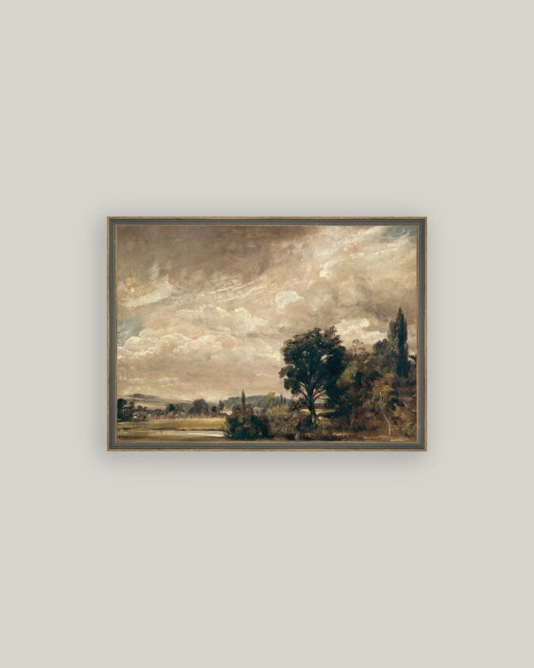 Framed landscape painting on a plain wall