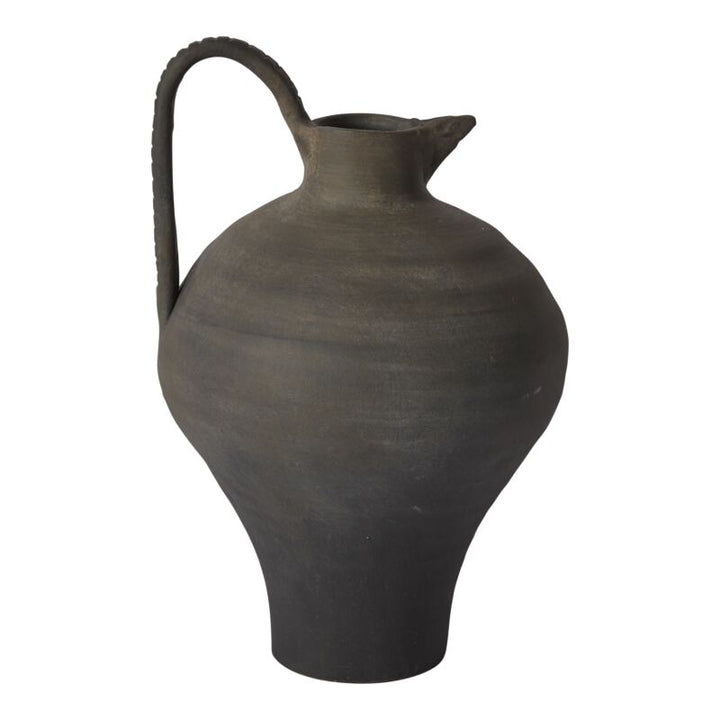 Black ceramic pitcher on a white background