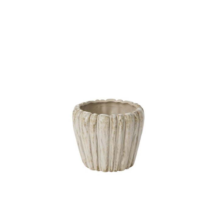 Decorative pot with a textured surface on a white background