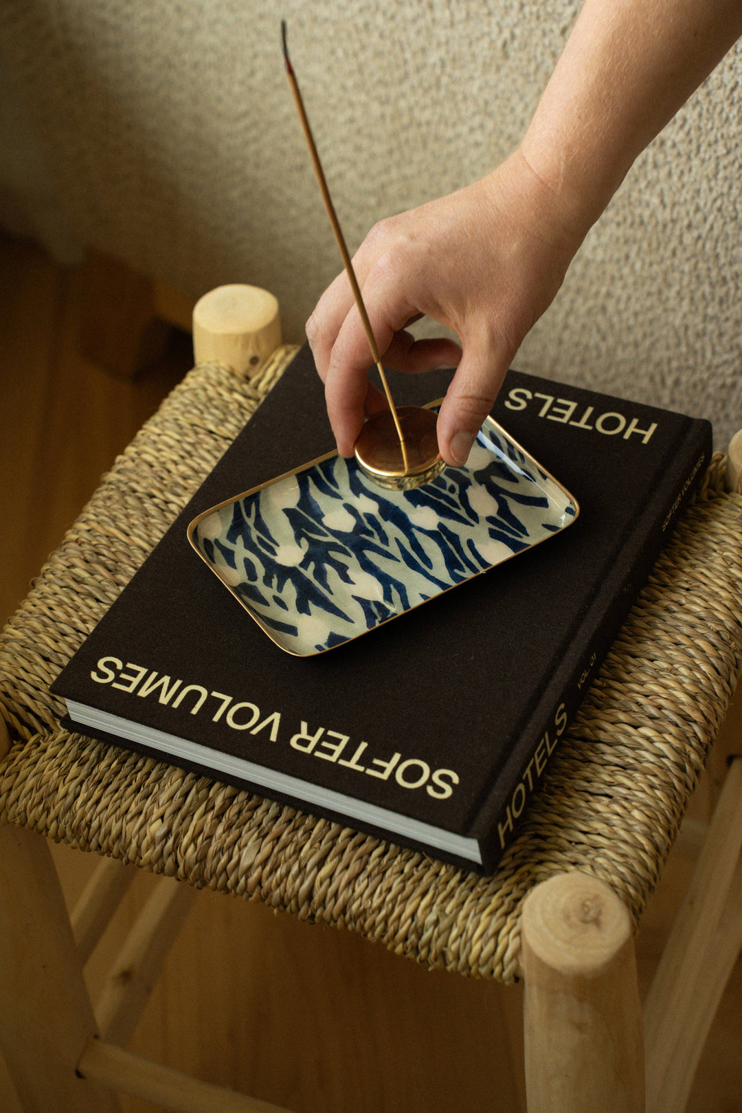  small tray with a floral pattern over a book 