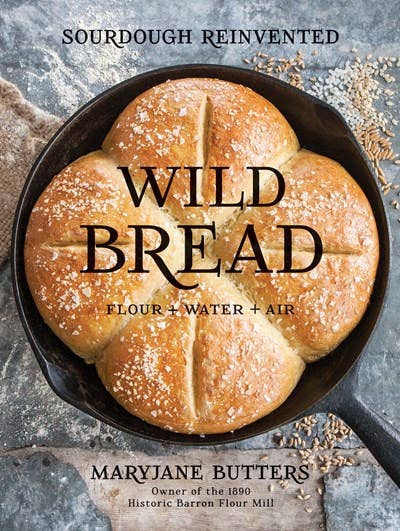 Book cover of 'Wild Bread' with bread in a pan and text about sourdough.