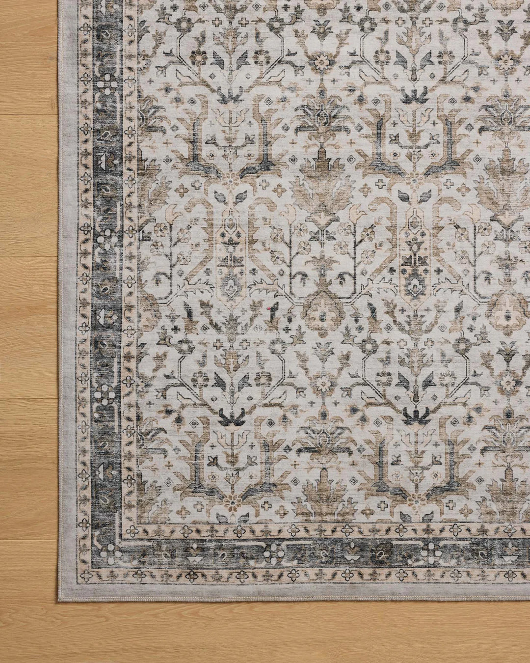 washable rug with traditional motifs in beautifully stone like and distressed tones