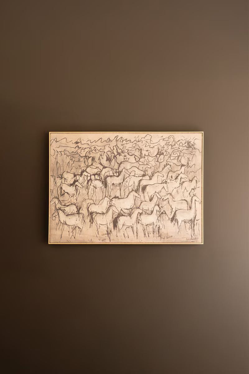 Framed artwork of horses on a brown wall