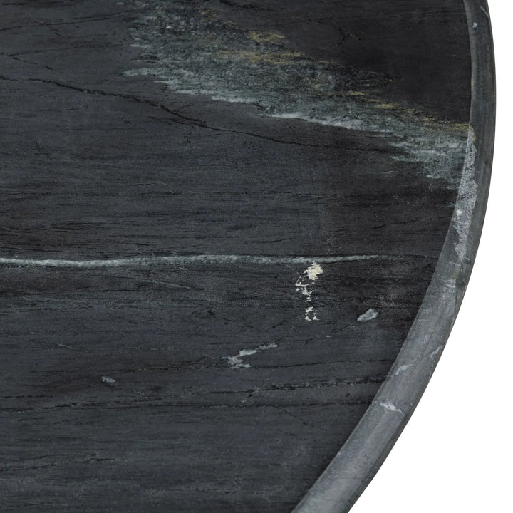 close up black marble round coffee table
