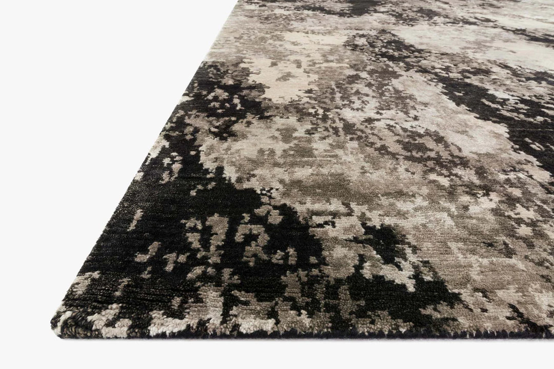 Abstract patterned rug with black, gray, and beige colors 