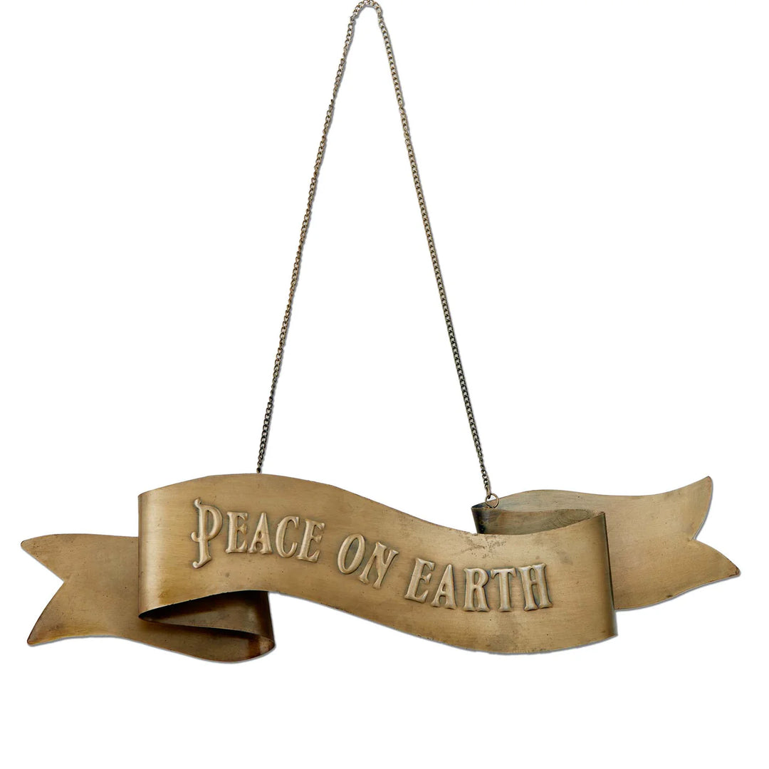 ribbon shaped gold hanging door sign with peace on earth on it