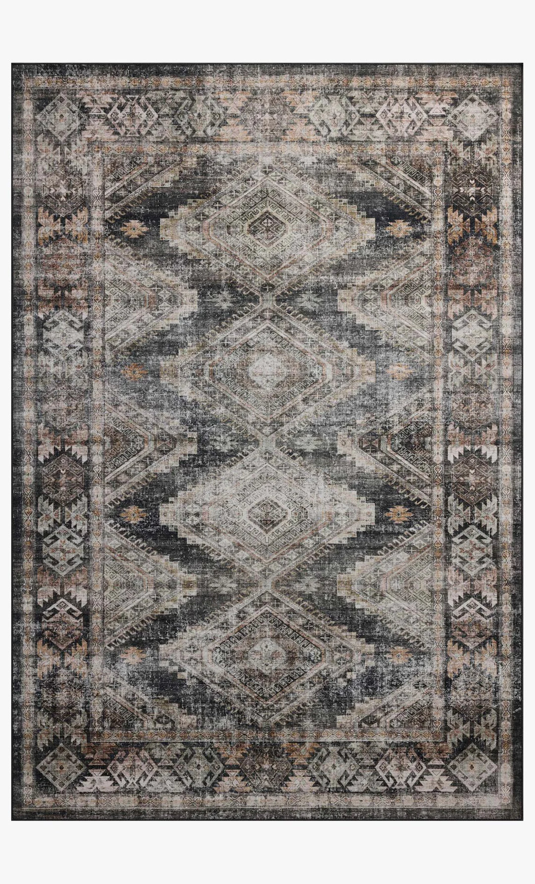 Patterned rug with geometric design in shades of gray, black, and beige on a white background