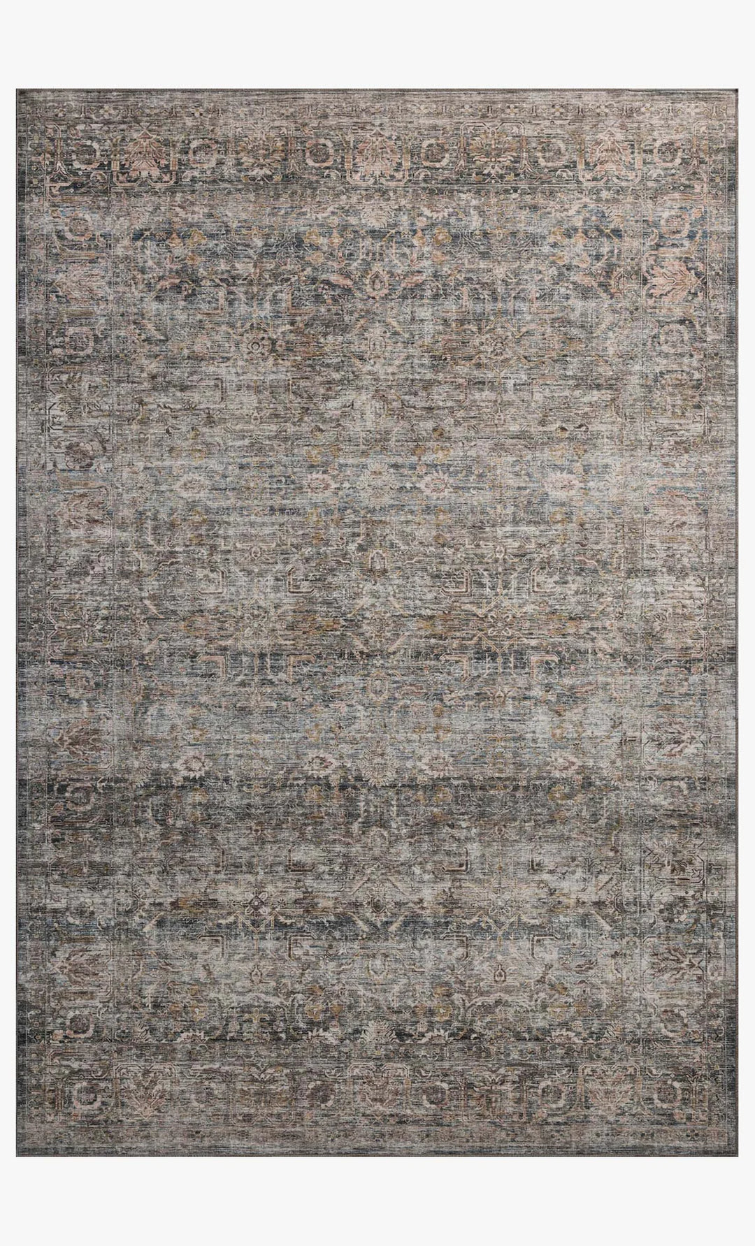 patterned rug with brown , blue, and burnt orange neutral tones