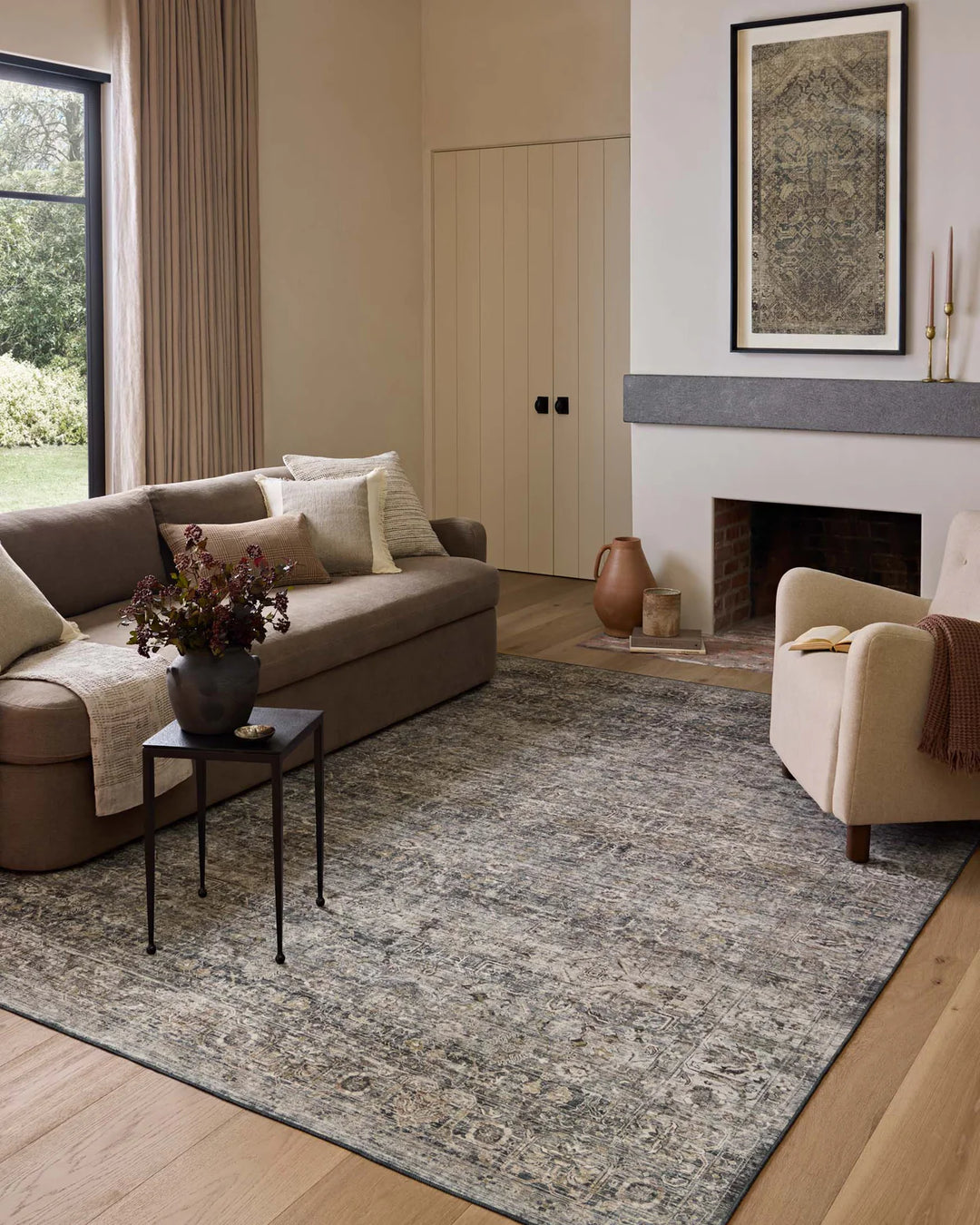 patterned rug with brown , blue, and burnt orange neutral tones
