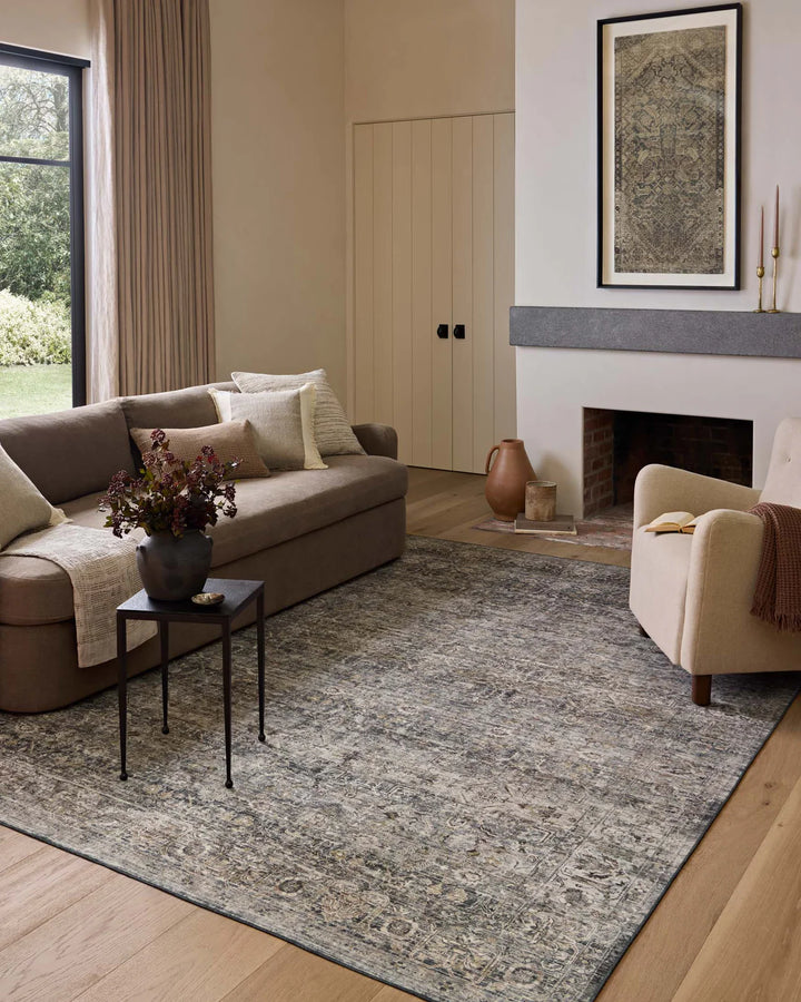 patterned rug with brown , blue, and burnt orange neutral tones