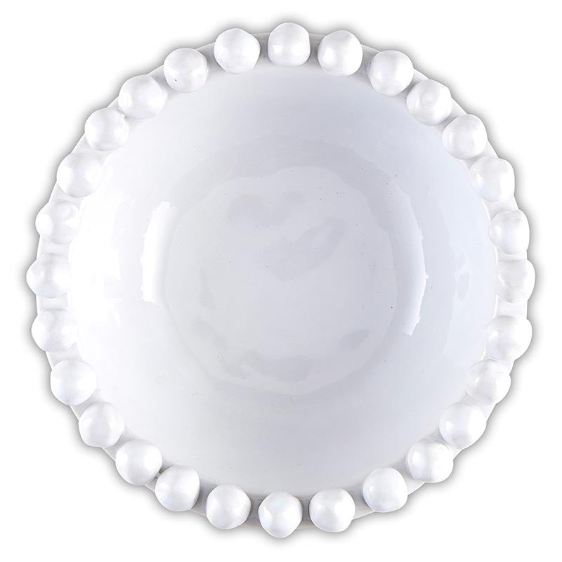 White ceramic plate with decorative bead edge on a white background