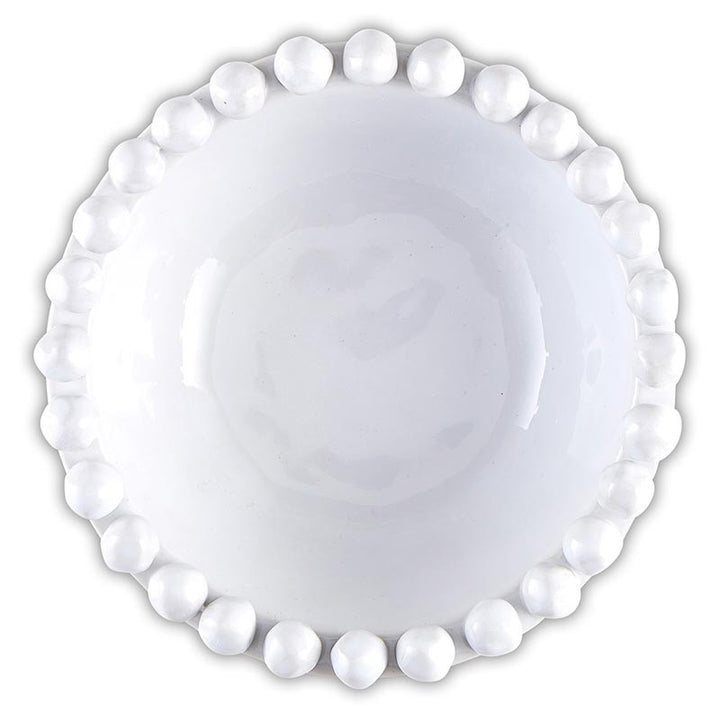White ceramic plate with decorative bead edge on a white background