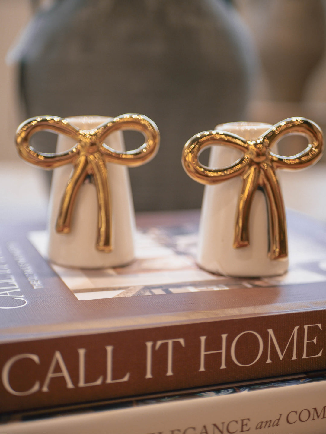 Decorative taper candle holder with gold bow 