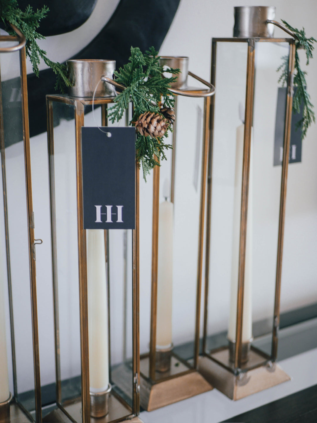 Decorative gold candle holders with greenery 