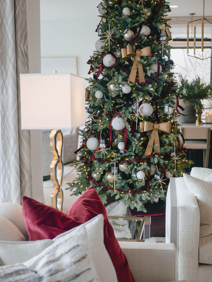 Decorated Christmas tree in a living room with festive decorations.