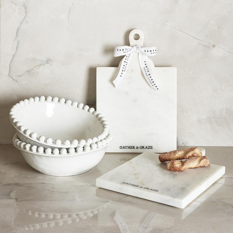 White ceramic bowls with beading around the top
