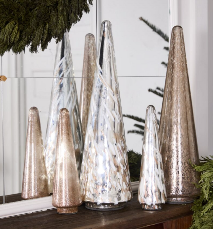 Two rose gold conical glass Christmas trees of different sizes with a reflective surface.