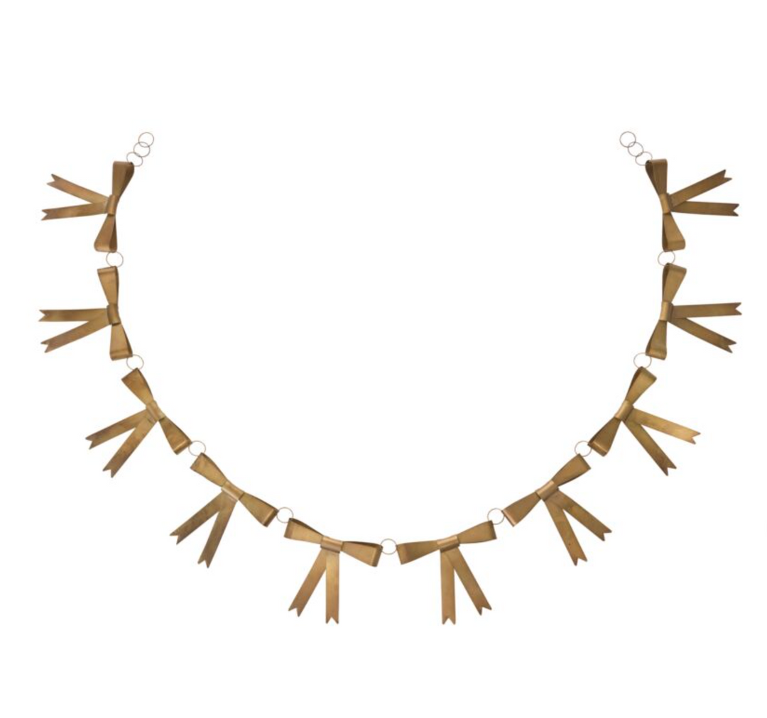 A gold-colored metal garland with classic bow decorations, suitable for holiday decor.