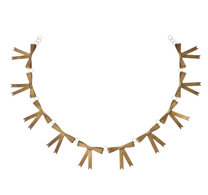 A gold-colored metal garland with classic bow decorations, suitable for holiday decor.
