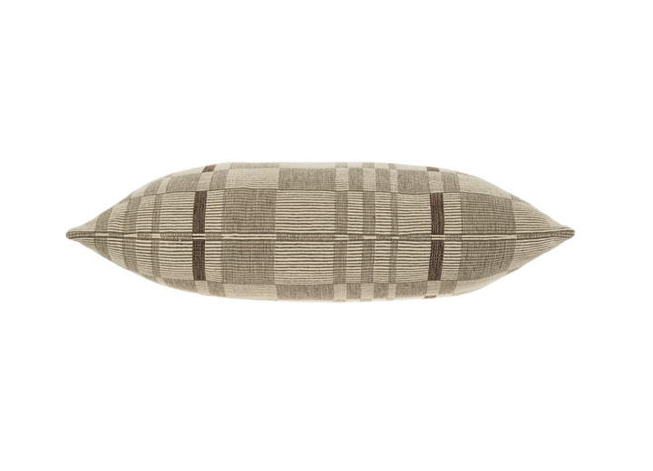 A beige and brown geometric patterned throw pillow.