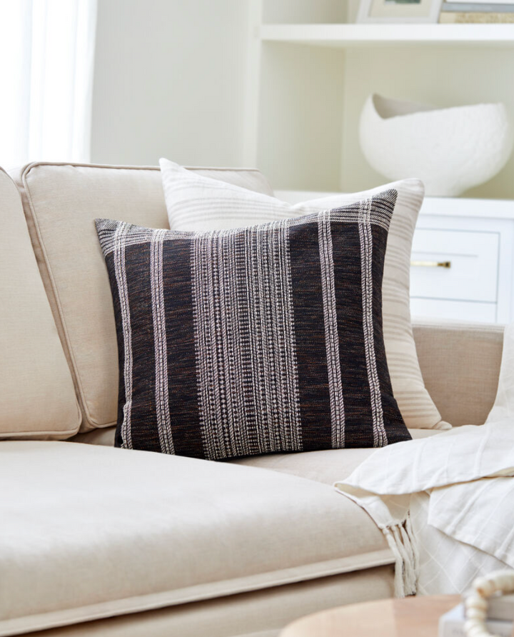 black throw pillow with stripes