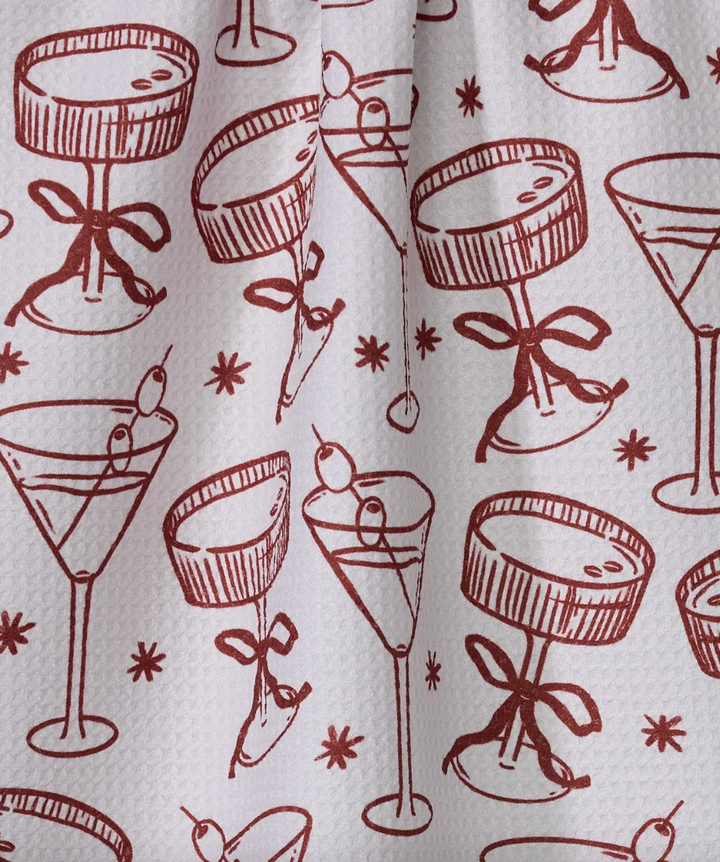 Pattern of red cocktail glasses with olives on a white background