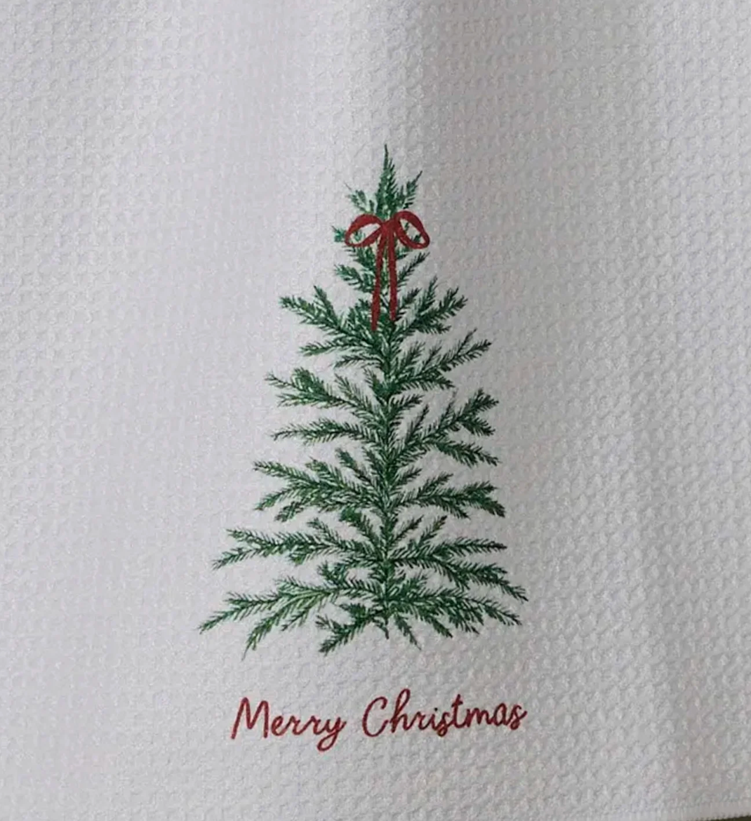 A set of three brass cheese knives with reindeer handles, displayed alongside a printed drawstring bag 