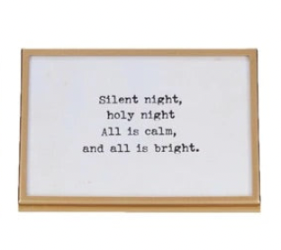gold finish metal and glass frames with easels and Christmas-themed sayings written in them.
