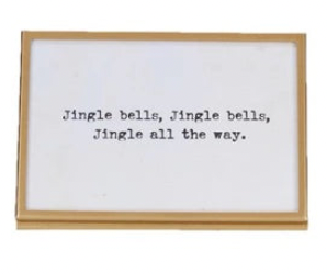 gold finish metal and glass frames with easels and Christmas-themed sayings written in them.