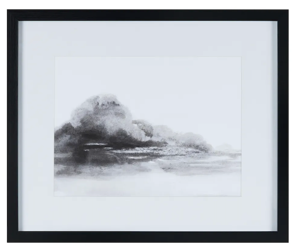 Framed black and white artwork of a mountain landscape.