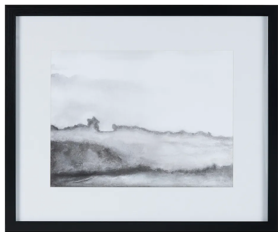 Framed black and white landscape print of a mountainous scene.
