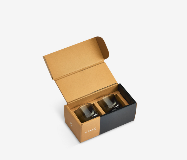 Two gray Fellow espresso cups in a black and brown box on a white background