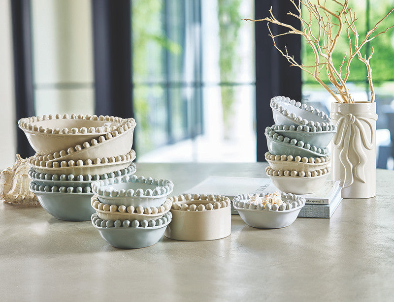 Set of ceramic bowls on a table with a blurred indoor background