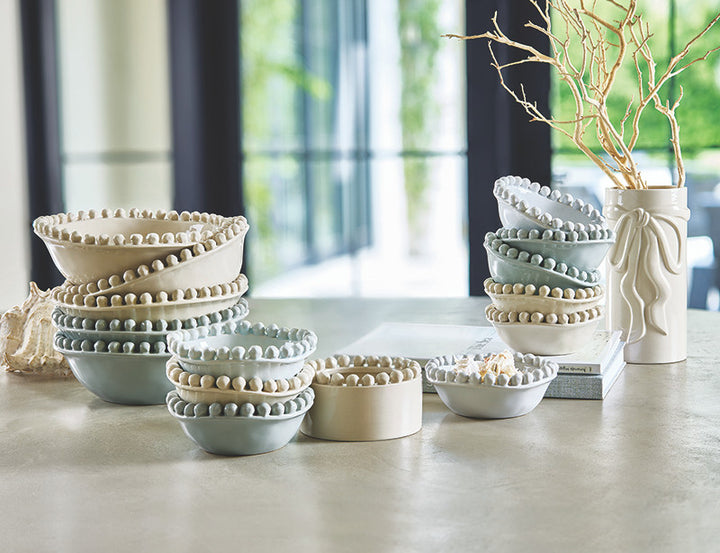 Set of ceramic bowls on a table with a blurred indoor background