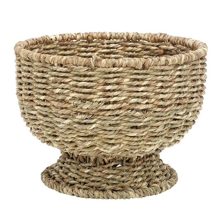 Woven basket made of natural fibers on a white background