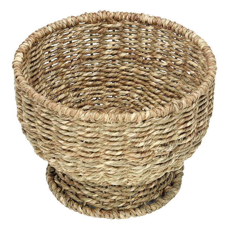 Woven basket made of natural fibers on a white background