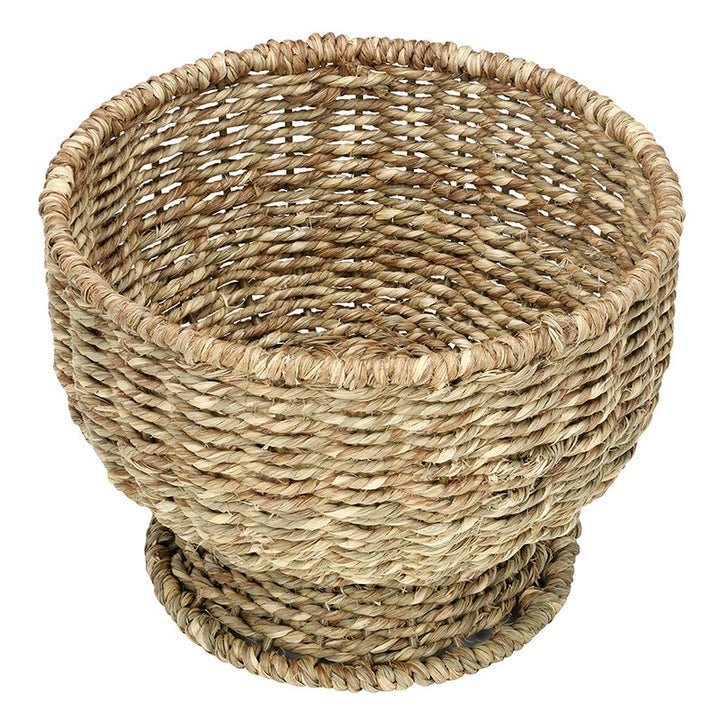 Woven basket made of natural fibers on a white background