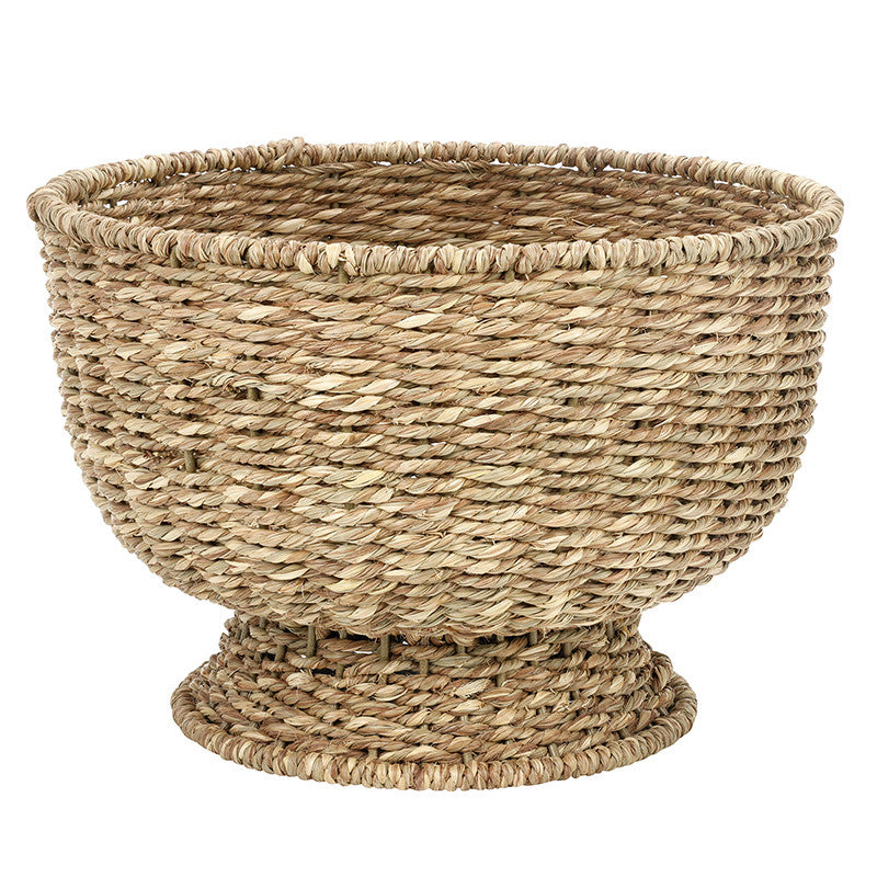 Woven basket made of natural fibers on a white background