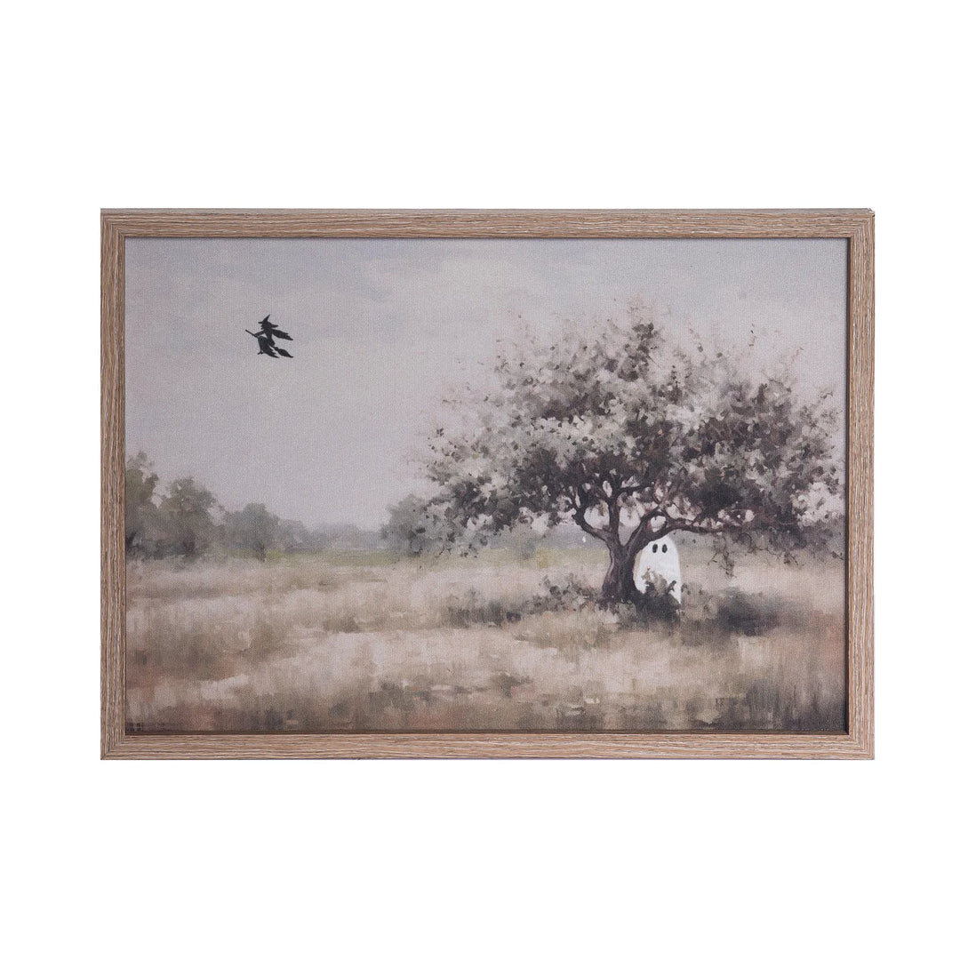 halloween framed art with ghost hiding behind tree and witch flying above