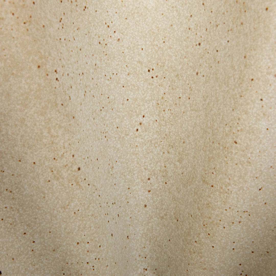 close up of cream stoneware pleated glass bowl