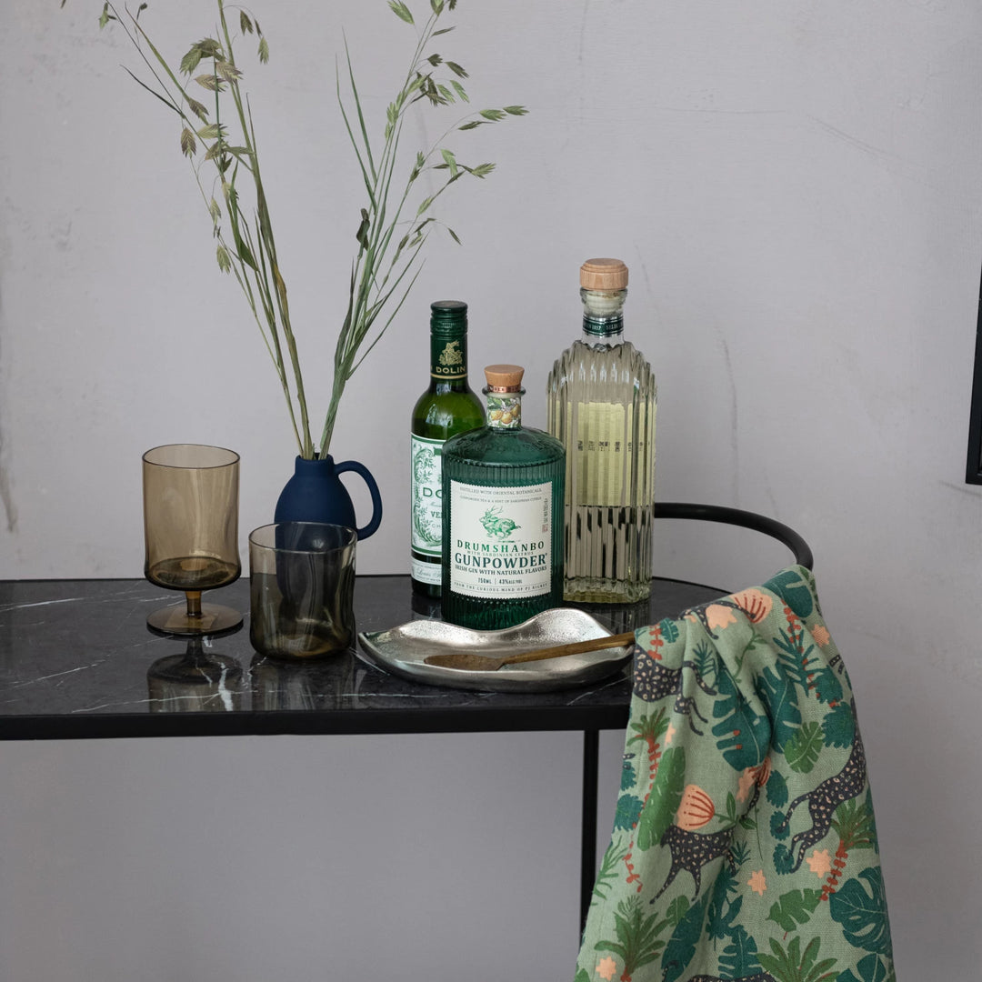 smoky green glasses decorated one with stem and one without