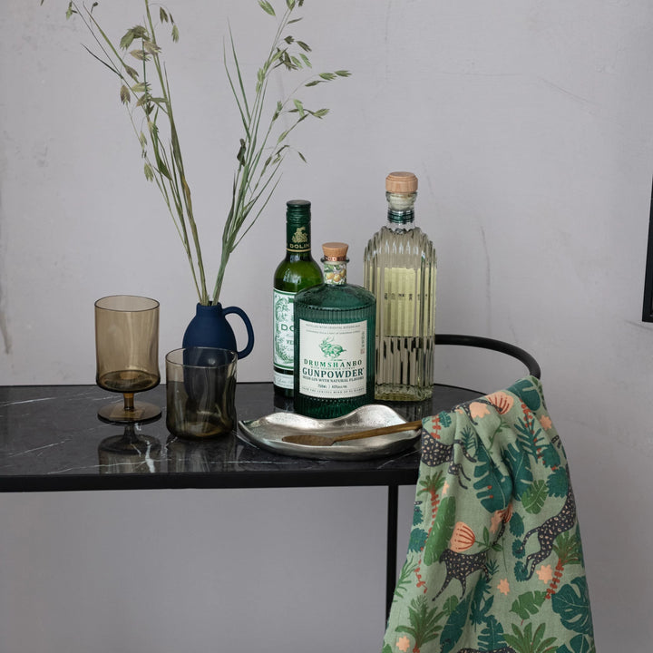 smoky green glasses decorated one with stem and one without