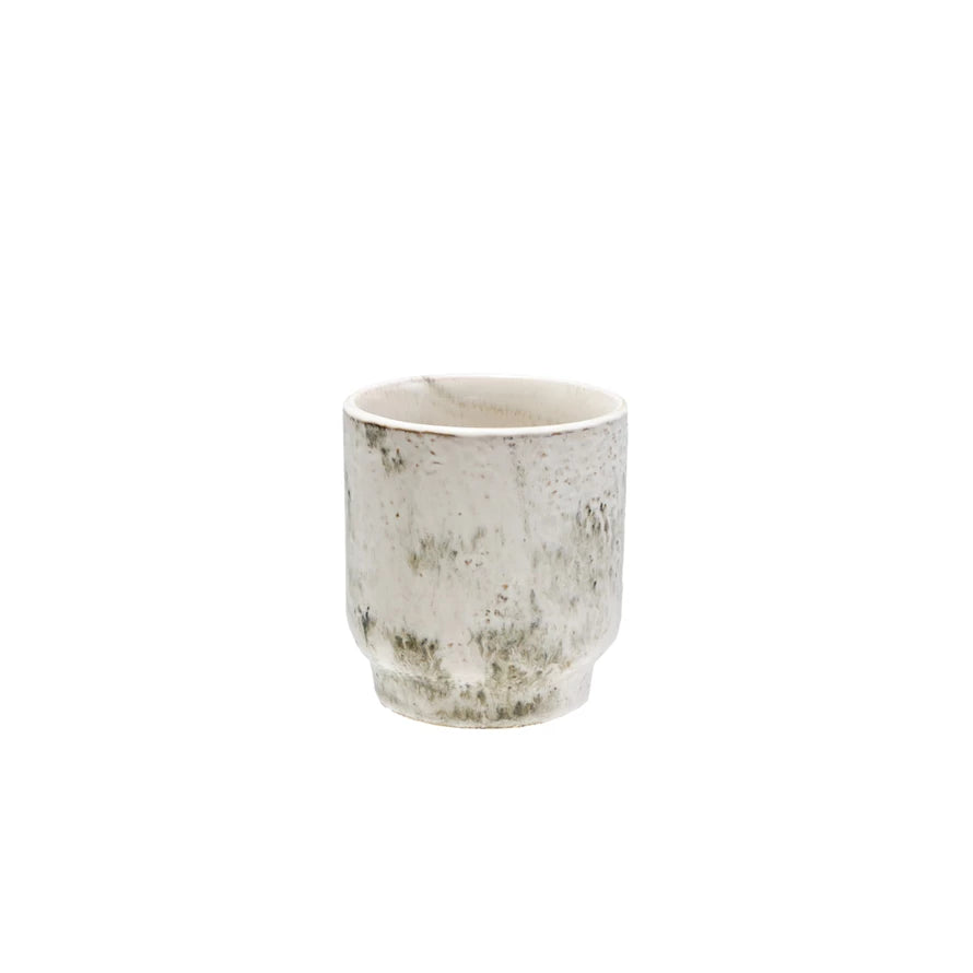 White ceramic planter with speckled pattern on a white background