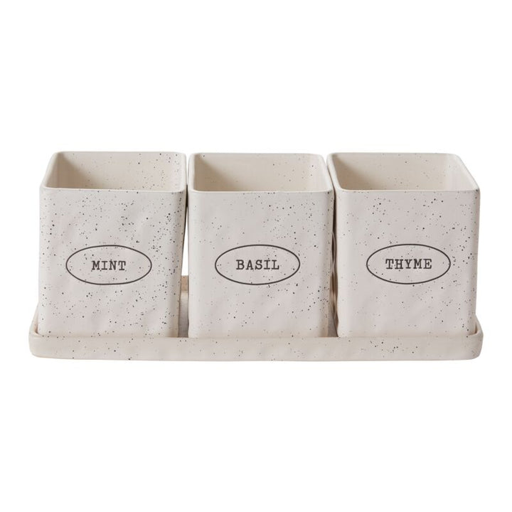 Set of three speckled ceramic containers labeled 'Mint', 'Basil', and 'Thyme' on a white background.
