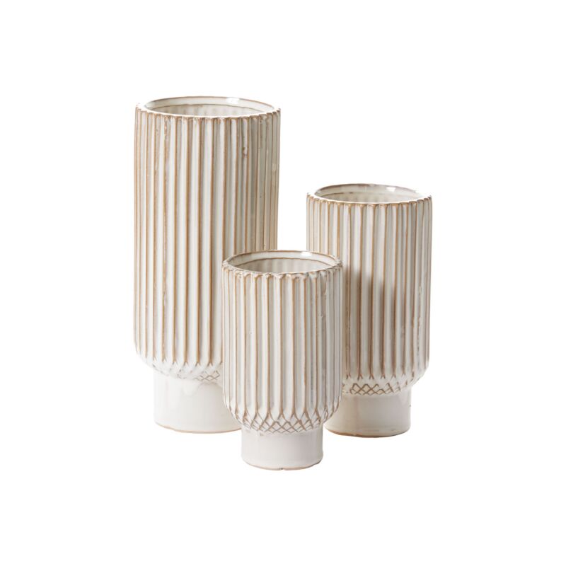 Set of three cylindrical vases with ribbed texture on a white background