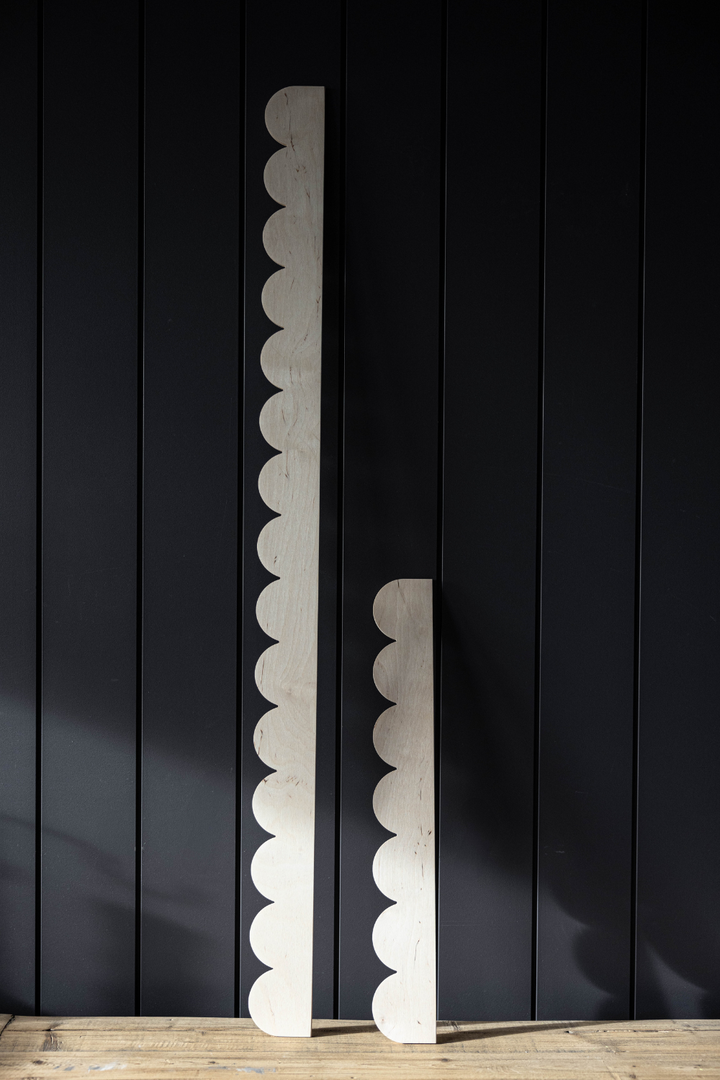 Decorative trim with scalloped edge design