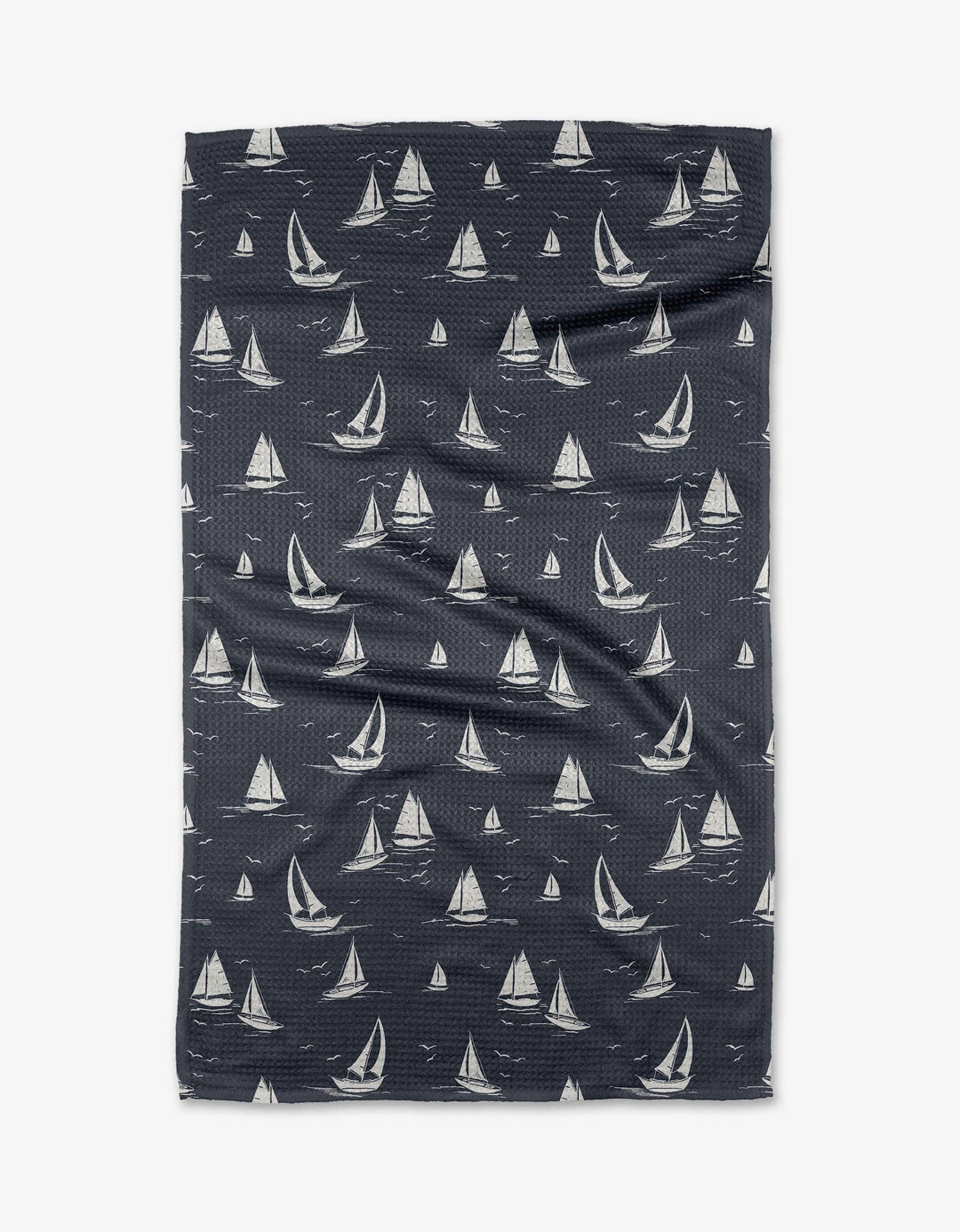 Folded fabric with sailboat pattern on a white background